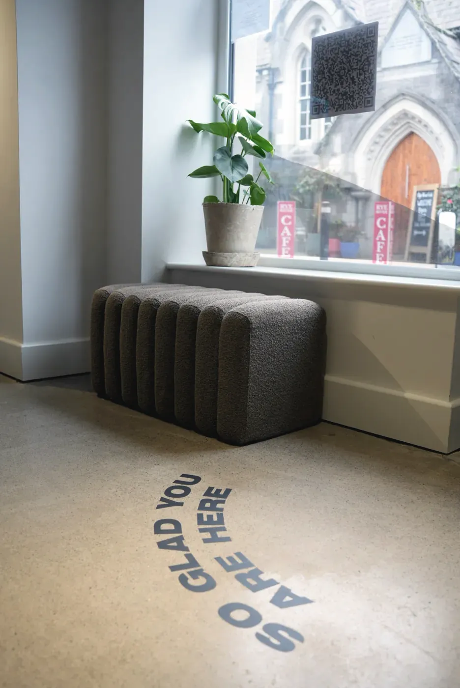 'So glad you are here' written on the floor at an Excape studio